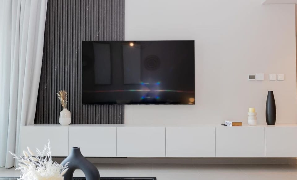 Whether you're enjoying a quiet night in or entertaining guests, the TV provides the perfect entertainment hub.