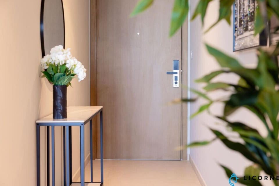 A simple yet elegant entryway with a console table and decorative flowers, creating a warm welcome.