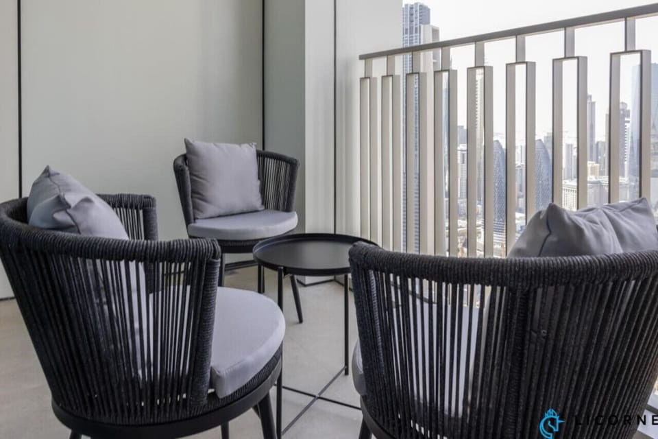 Sip your morning coffee on the balcony, complete with comfortable chairs and a stylish coffee table.