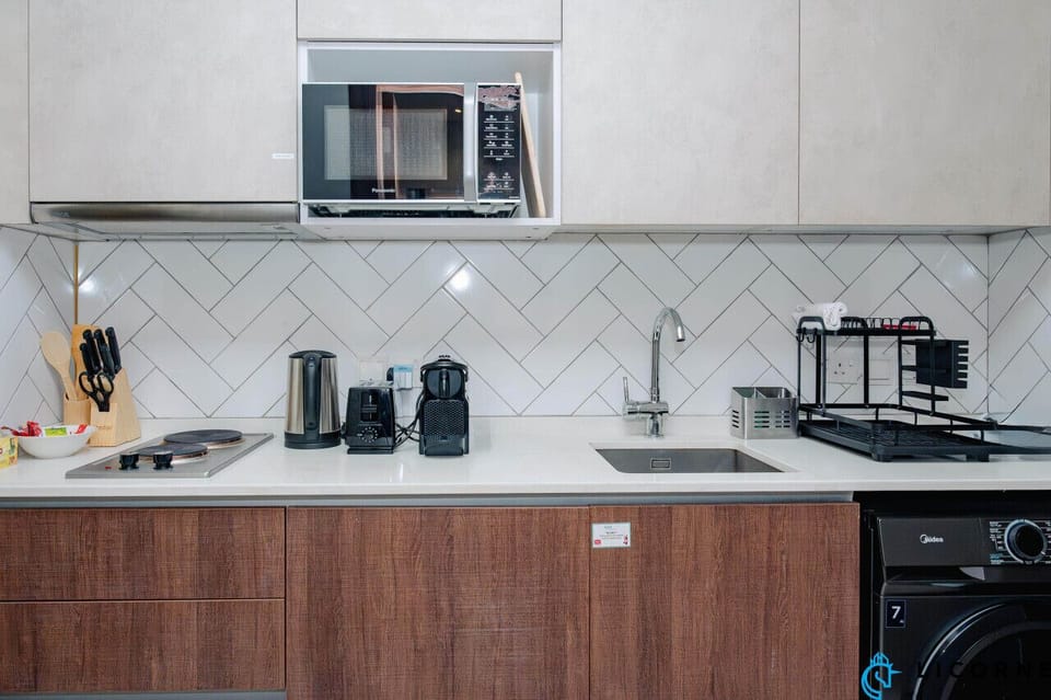 Prepare your favorite dishes in this sleek and fully equipped kitchen, complete with everything you need.