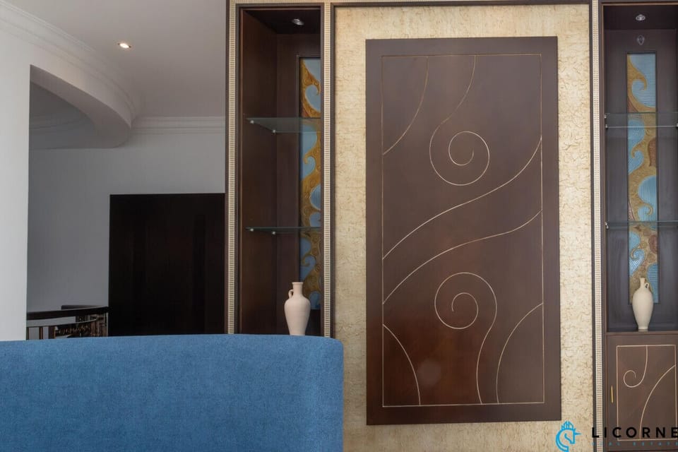 Communal working area with modern blue seating and elegant wall décor."
