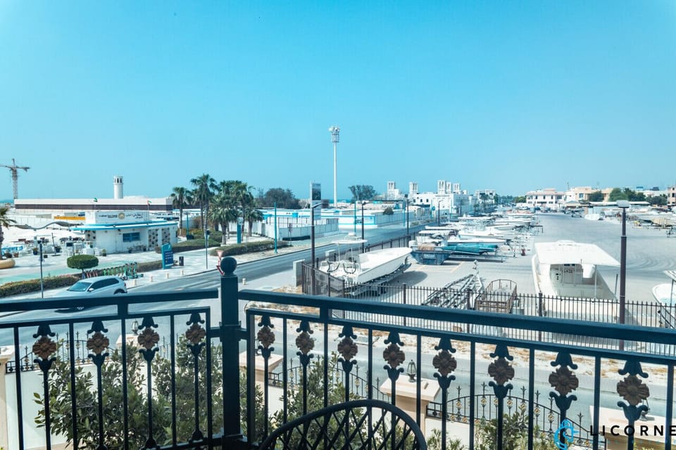 Enjoy views of the marina and the vibrant surroundings from your private balcony.