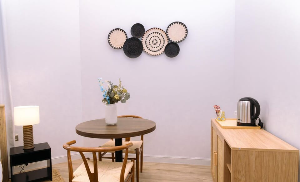 Stylish dining nook with modern décor, perfect for enjoying a cup of coffee or tea.