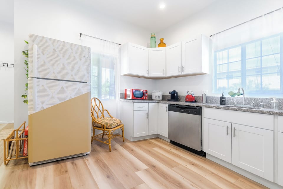 Kitchen with uniquely designed fridge and freezer and a chill out nook.