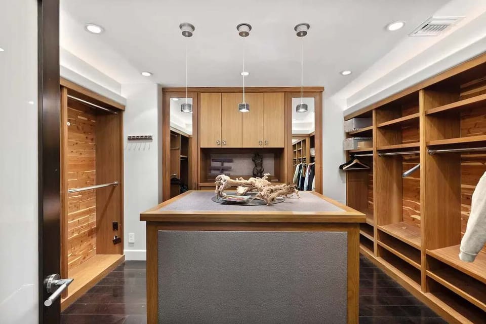 Step into luxury with a master walk-in closet designed for ultimate comfort.