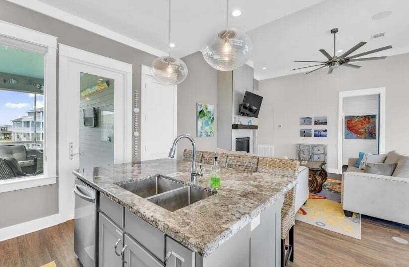 Kitchen island with granite countertops and pendant lighting