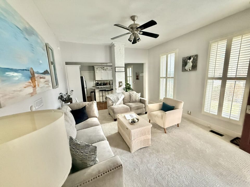 Living Room - The coffee table and chair can be moved in order to fit the queen air mattress that we provide.