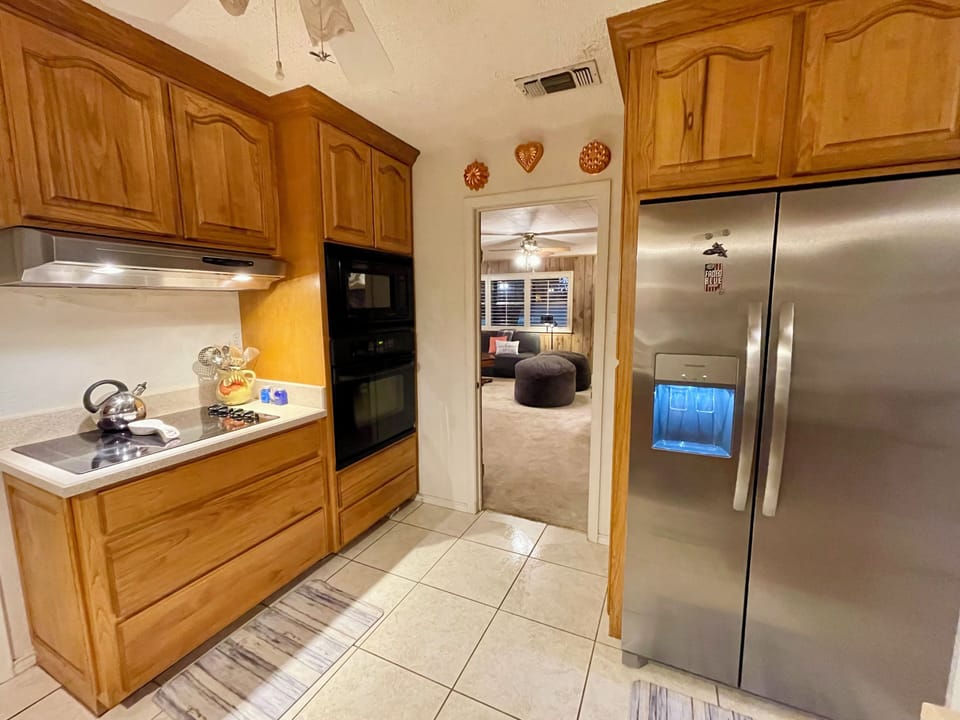 From kitchen, door to rec room, new stainless fridge