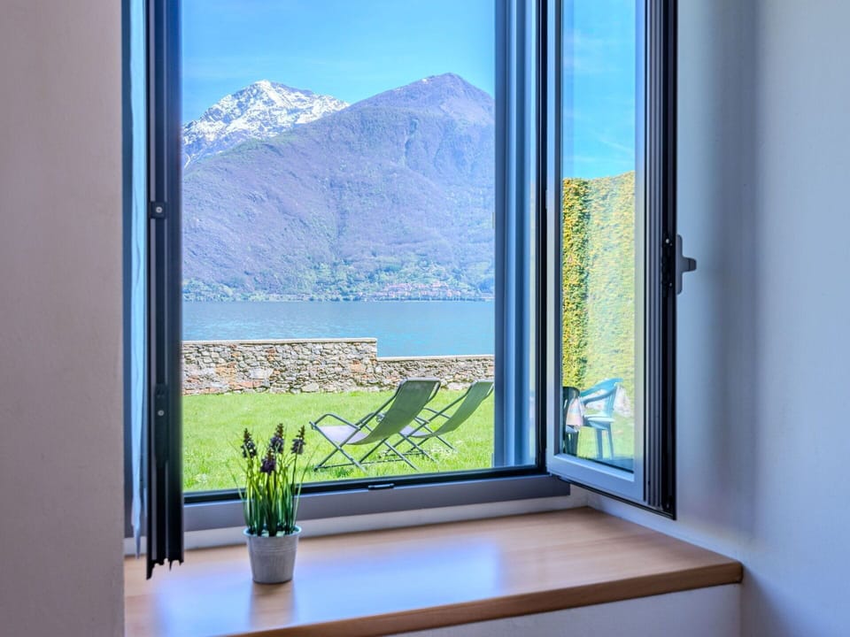 Sky, Plant, Cloud, Building, Window, Tree, Natural Landscape, Land Lot, House, Cottage