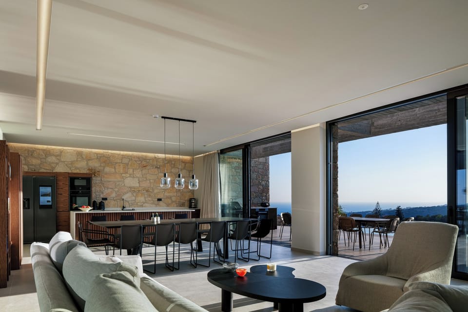 Open plan living and kitchen area, with direct access to the pool area