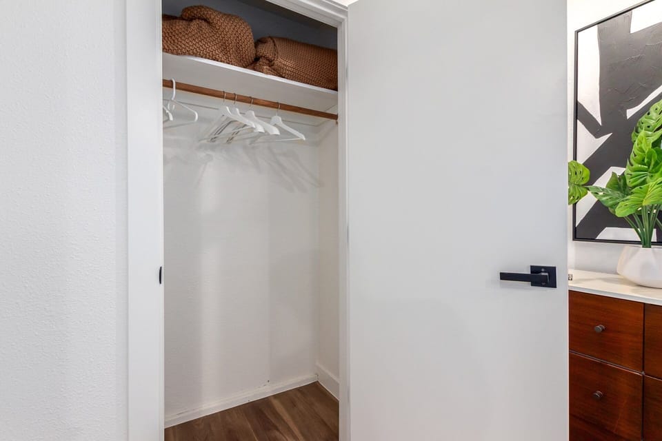3rd bedroom featuring 2 Full Beds, dresser, and a closet.