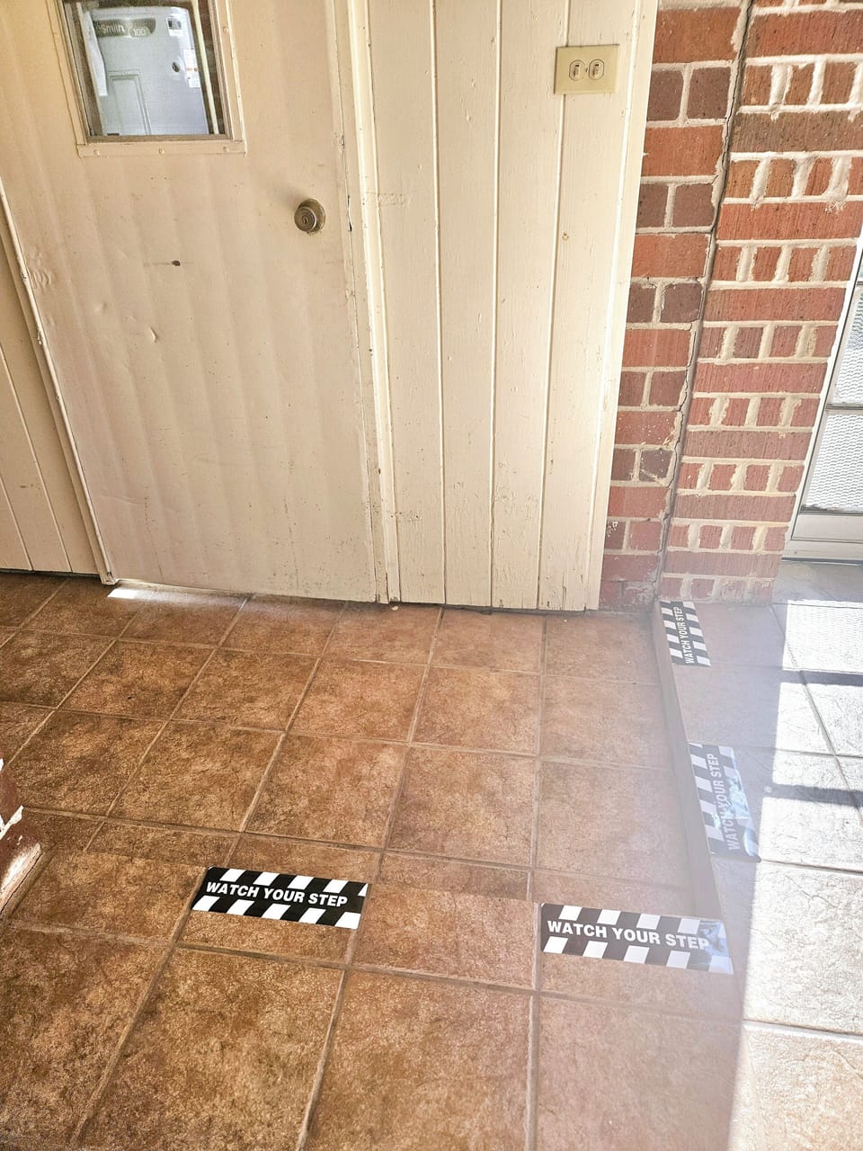 There is a step down located by the laundry and carport doors. Be cautious!