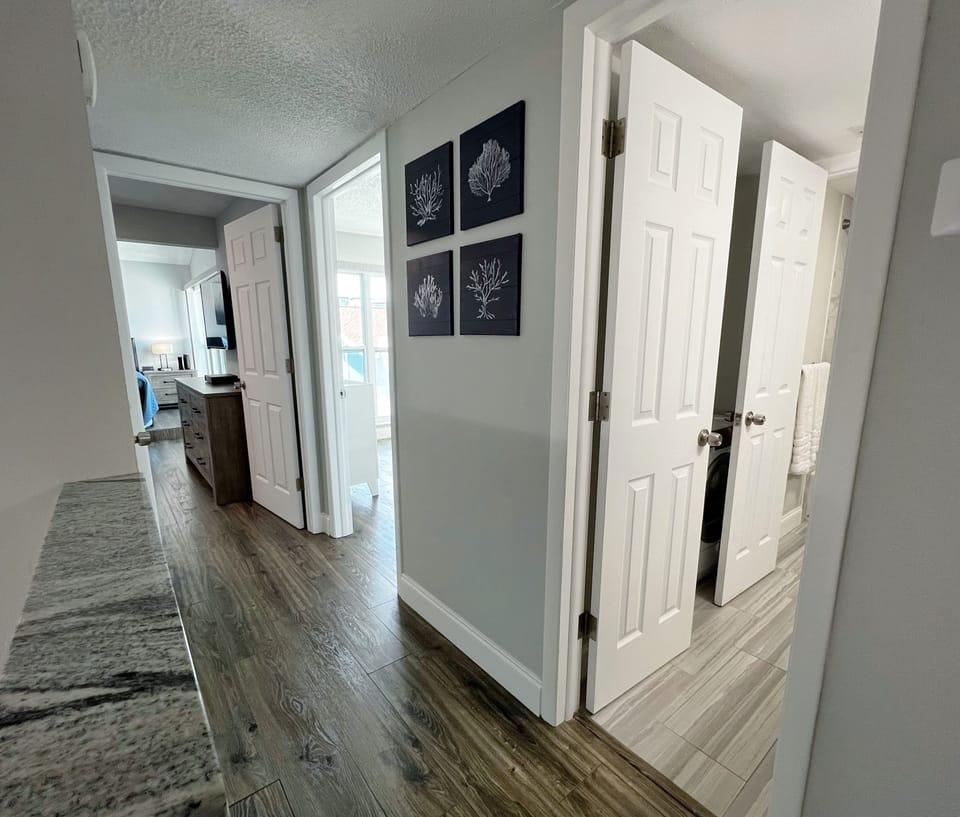 Top of the stairs and view of the bathroom, and both bedrooms. - Top of the stairs and view of the bathroom, and both bedrooms.