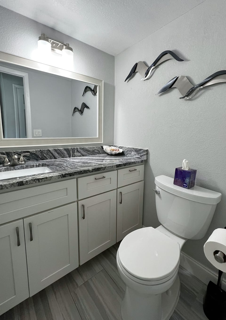 Updated half bathroom off the first floor of the unit for conven - Updated half bathroom off the first floor of the unit for convenience.