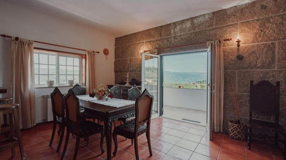 Elegant dining area with a rustic wooden table and classic accents, perfect for enjoying meals in a timeless setting. #ClassicElegance #CozyMeals