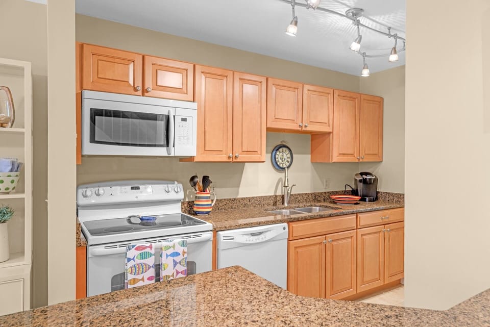 This quaint kitchen offers ample storage space & all the comforts of home