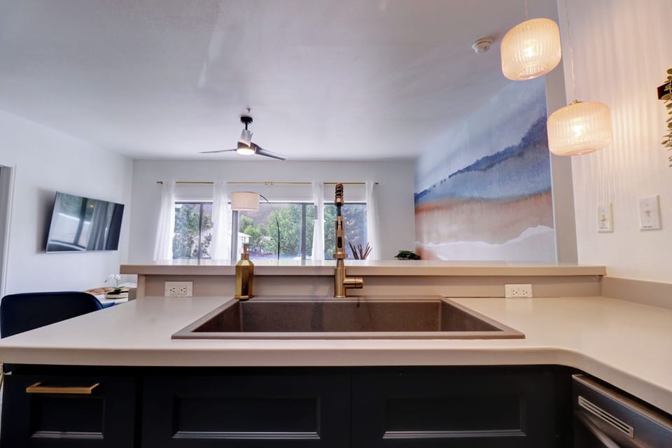 Large basin sink looking out to dining and living area