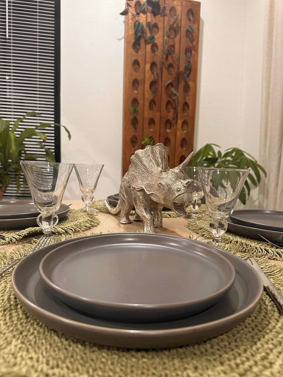 Dining table sits four with additional sitting on kitchen counter