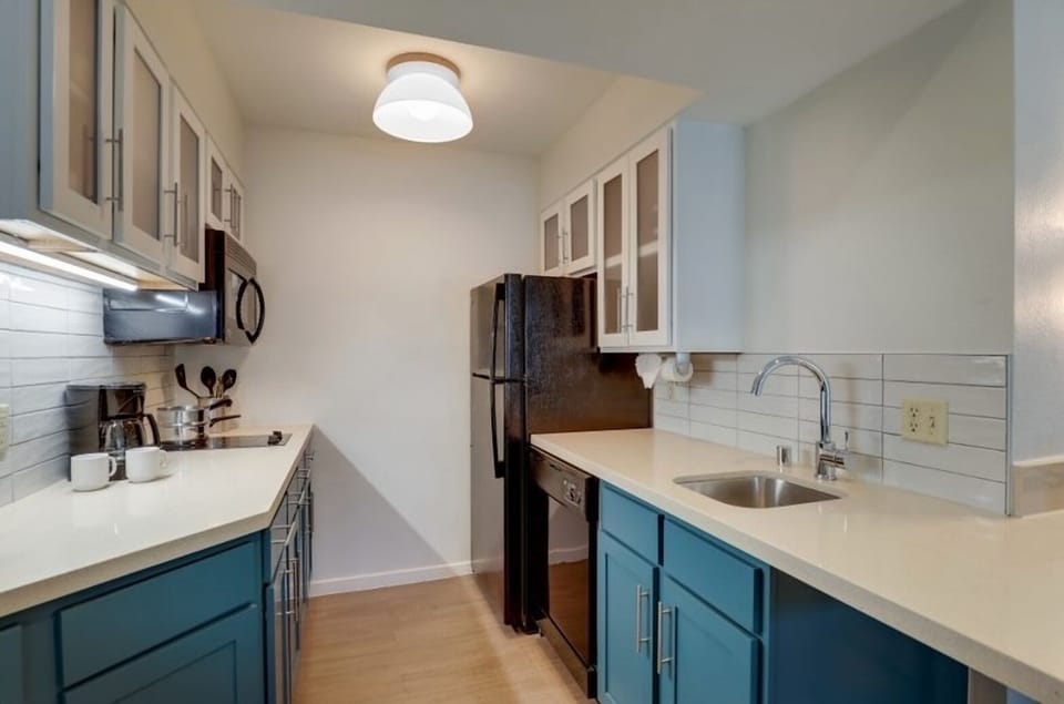 Cook with ease in a sleek kitchen with full-size fridge.