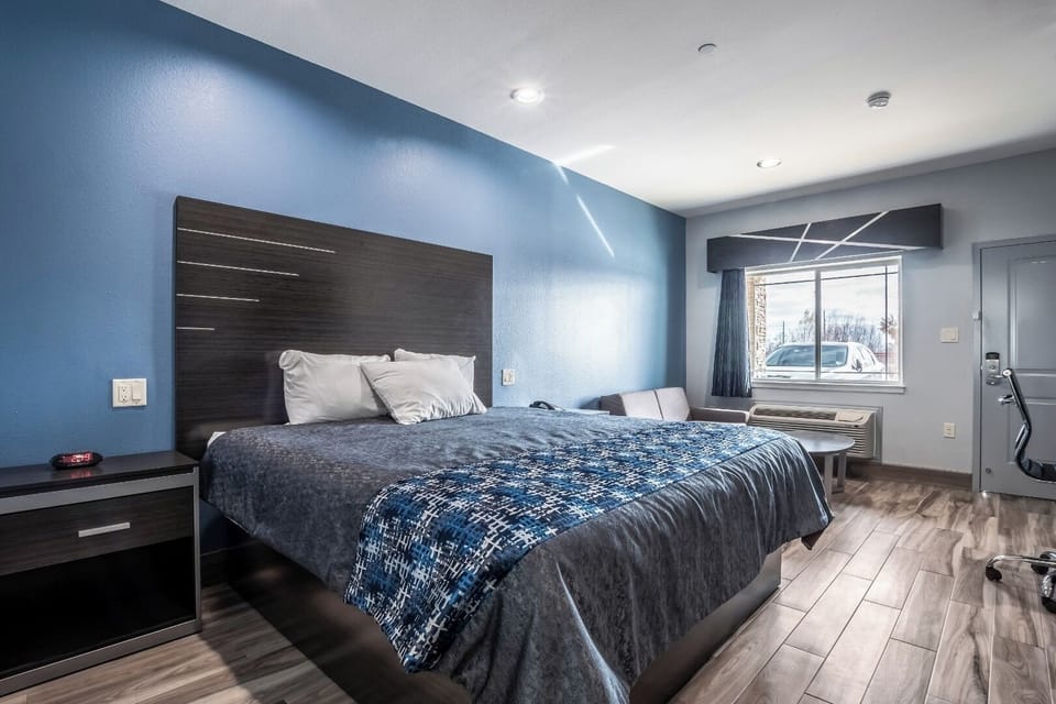 Recharge in a calm, minimalist room with crisp linens.