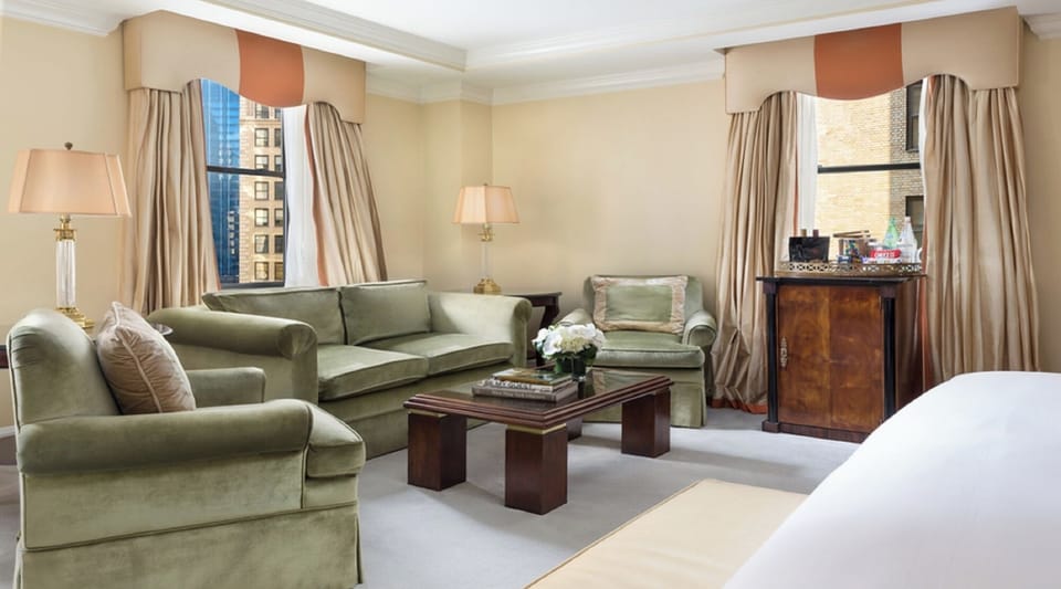 Lounge by the windows in a cozy, elegant seating area.