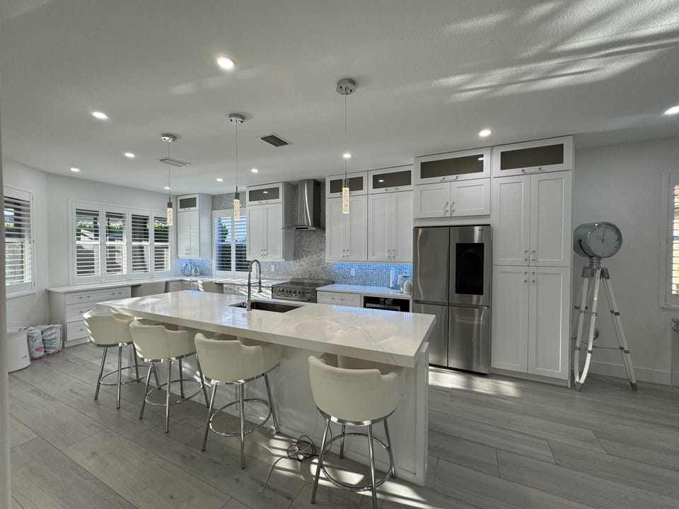 Kitchen with beautiful sunrise/ morning light coming in the back windows