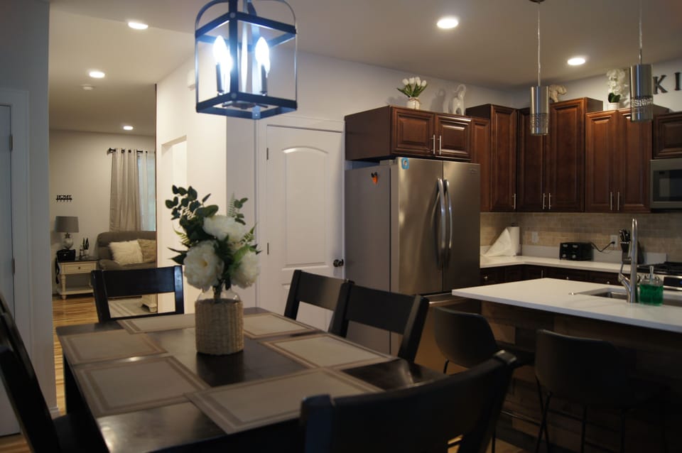 Dining, Island and Kitchen off of Living Room with back deck access