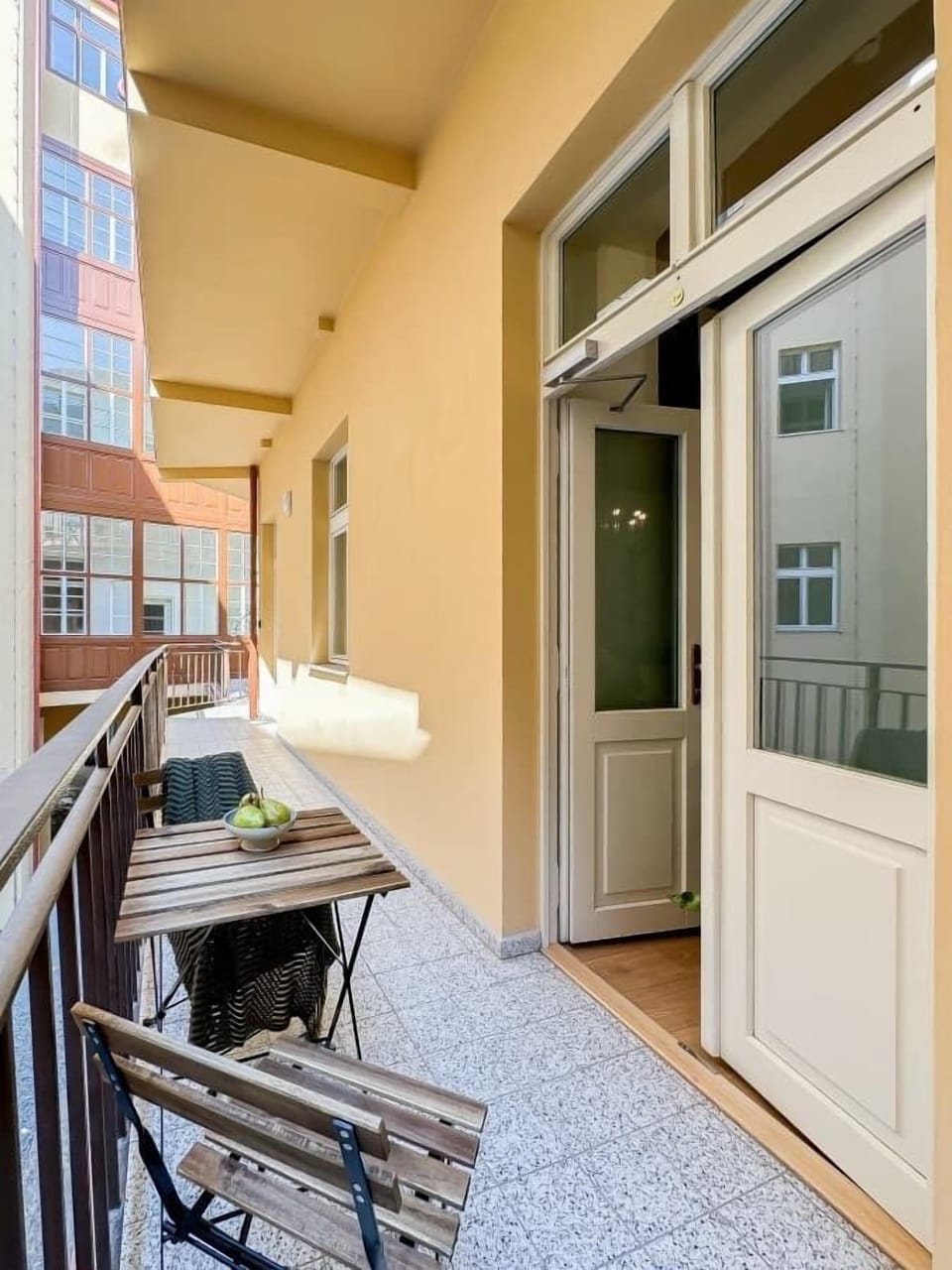 Outdoor seating before entrance to the apartment