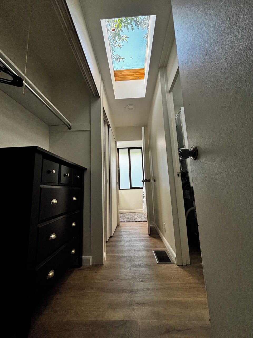 primary closet / hallway to bath / skylight
