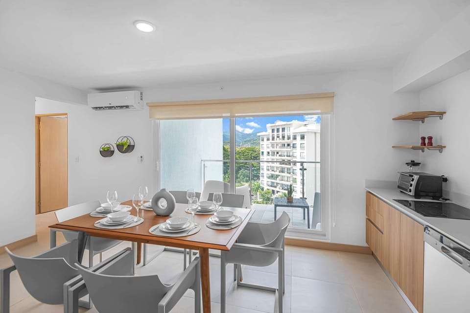 Dining Area: A warm and inviting lounge that flows seamlessly into the dining space. Perfect for both relaxation and shared meals, this area offers comfortable seating and a spacious table to enjoy time together.