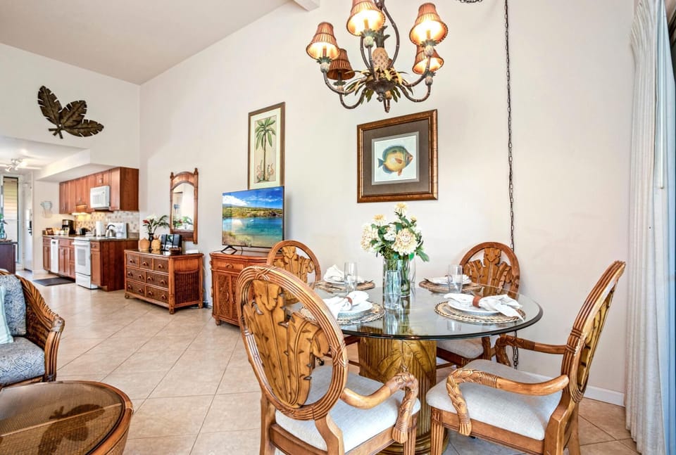 Glass glimmers, flowers beam, and your seat’s carved like paradise—this dining setup is made for breezy bites and laughs
