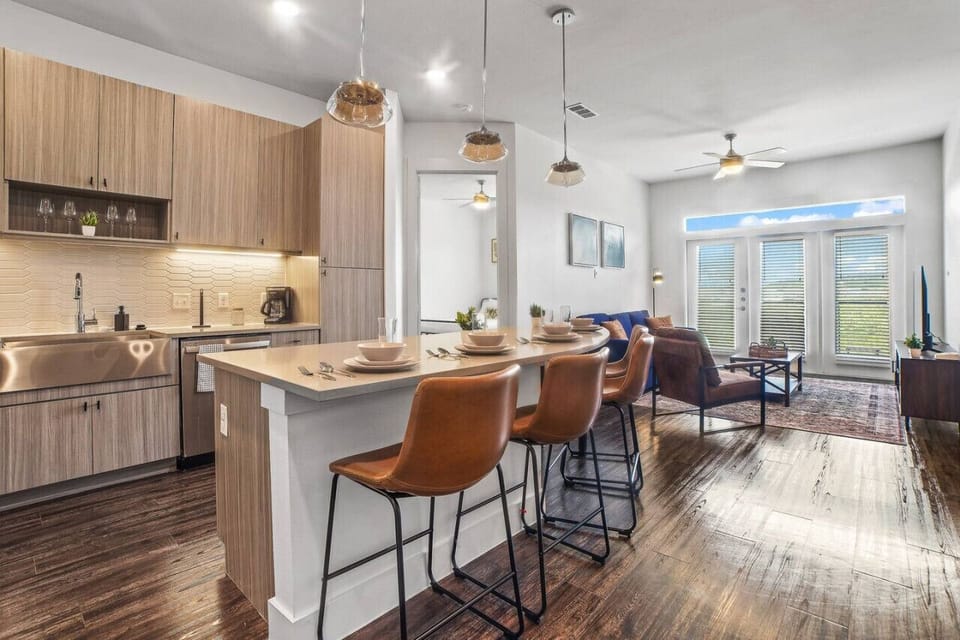 Set the table for memorable meals in this beautifully arranged dining area. With elegant place settings and a charming centerpiece, it's perfect for hosting dinner parties or enjoying family dinners in a cozy and stylish atmosphere.
