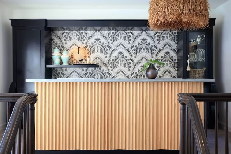 Gather at the chic bar for a cozy nightcap.