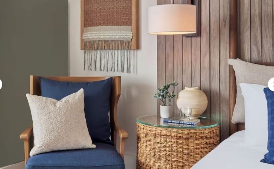 Enjoy soft bedside glow with curated decor and textures.