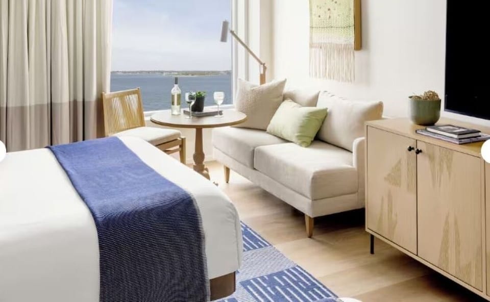 Unwind in crisp linens with soothing waterfront views.