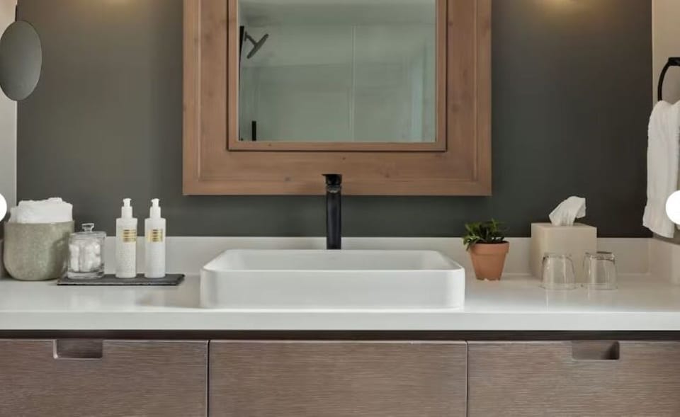 Refresh at the sleek vanity with spa-like, modern finishes.