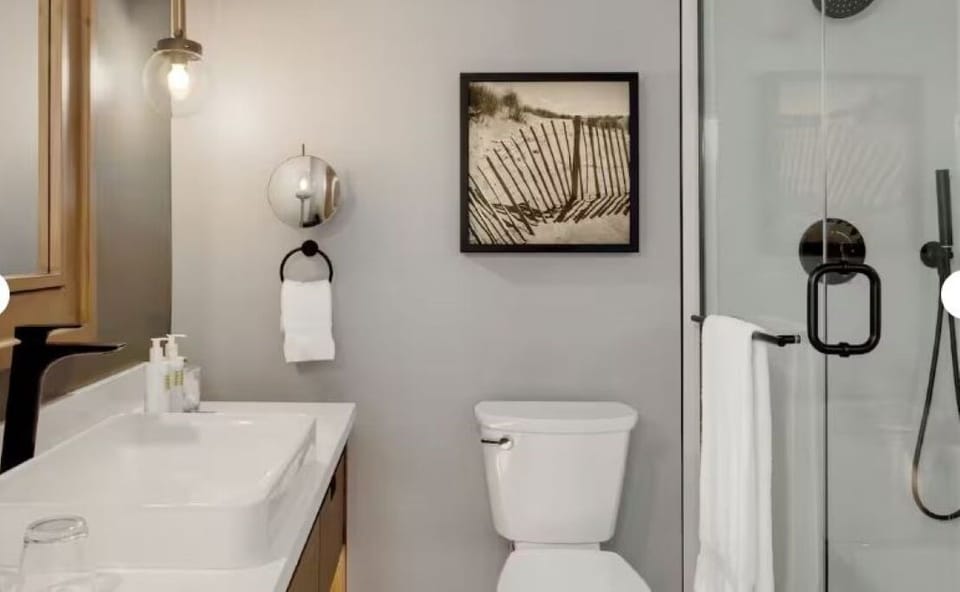 Refresh in a bright, modern bathroom with glass shower.