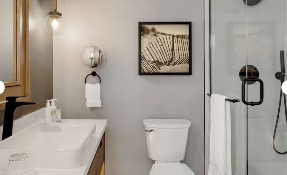 Refresh in a sleek bathroom with spa-like glass shower.