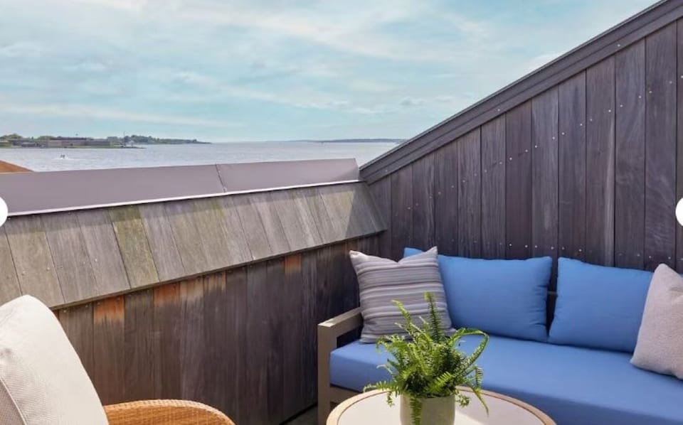Unwind on the breezy balcony with sweeping water views.