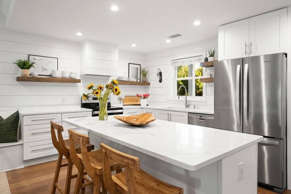 Gorgeous, modern and bright kitchen, featuring marble countertops throughout
