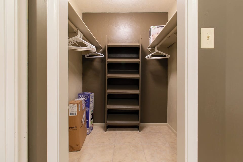Large walk in closet, also contains a pack n'play and high chair.