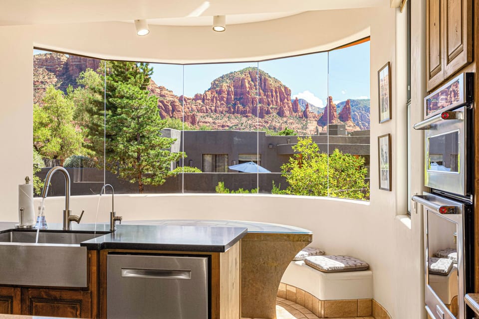 Savor a cup of coffee or take a quick break from cooking in the home's breakfast nook, offering amazing views of Sedona.