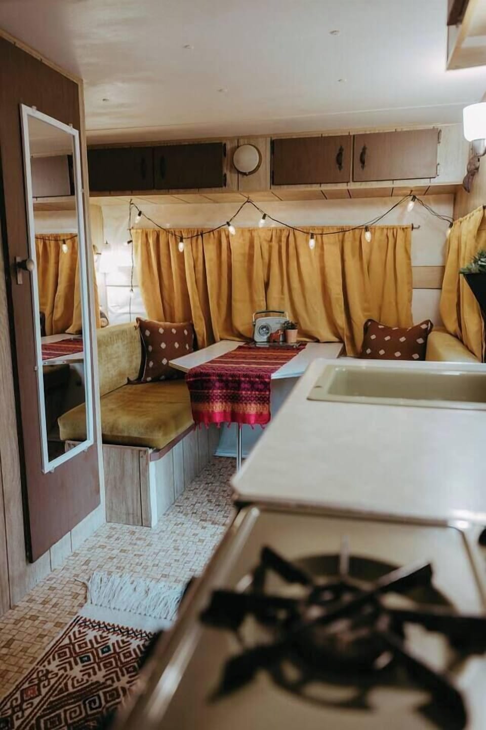 The 1973 Go-Tag-A-Long Camper offers a unique setting for photography or summer gatherings. (5)