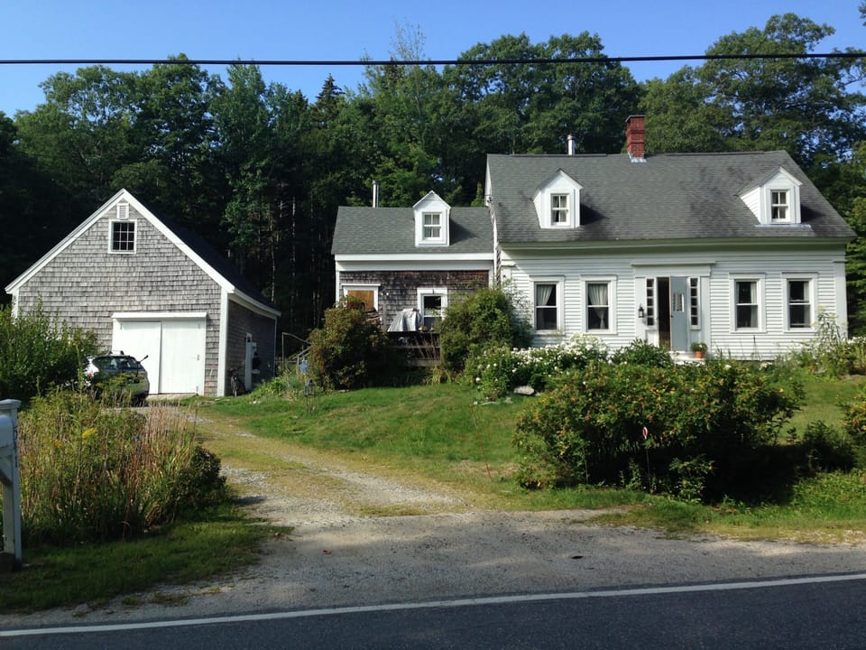 Traditional New England farmhouse. You will enter through the front door
