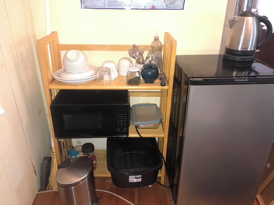 Minibar with small refrigerator, microwave, electric kettle for coffee/tea
