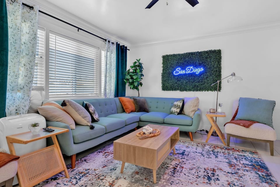 A cozy living room with blue accents, stylish couches, and elegant decor.