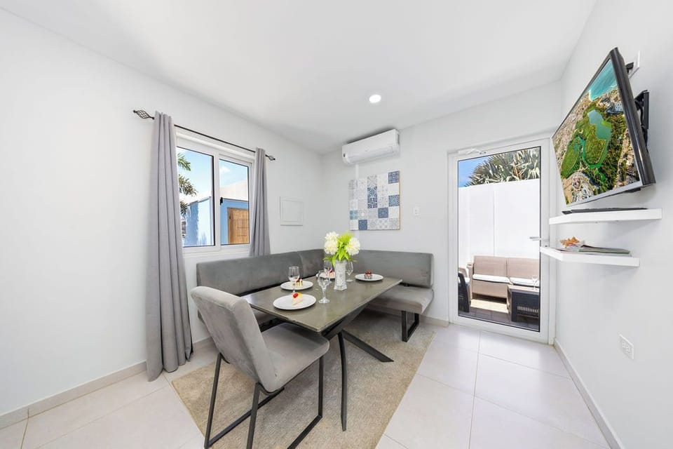 The open-concept design features a beautifully appointed dining space, ideal for enjoying meals with family and friends.