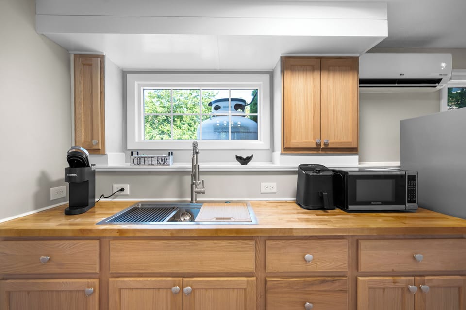 Enjoy a convenient kitchenette with microwave, toaster, and coffee station—perfect for light meals and snacks.