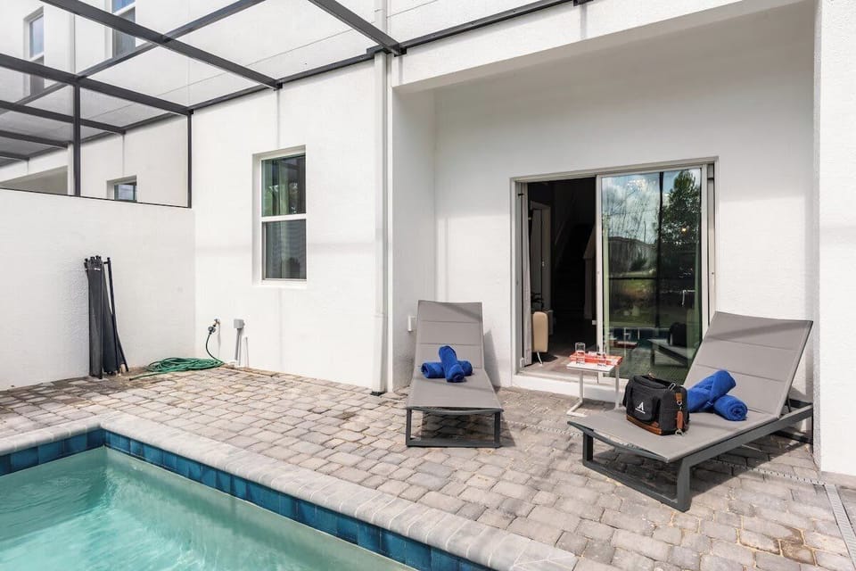 Enjoy the sun and relax by the fully fenced pool area, complete with comfortable sun loungers for your leisure.