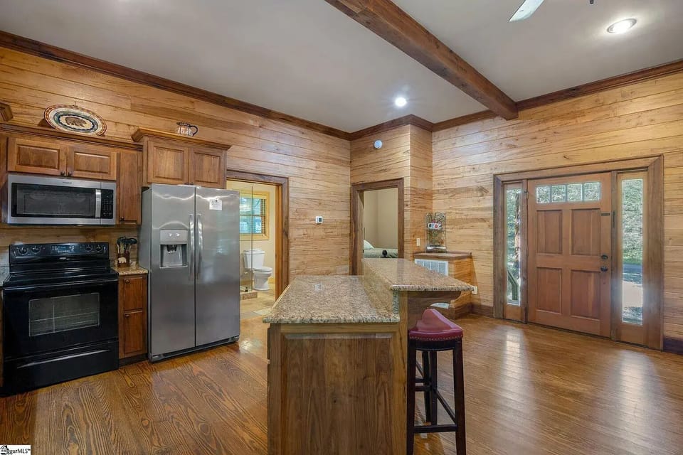 Kitchen leads to bathroom and bedroom